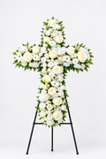 Shorter white floral cross on a studio stand